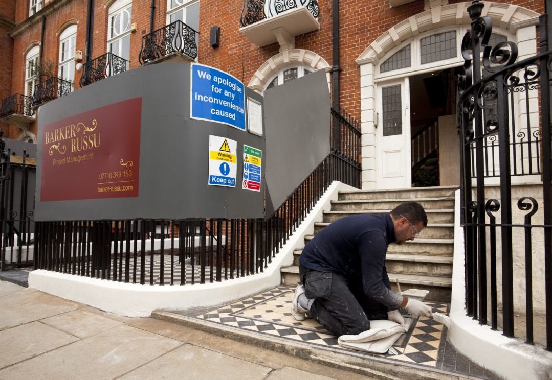 Barker Russu painting front steps outside London mansion block